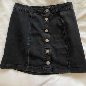 Black miniskirt with button detail